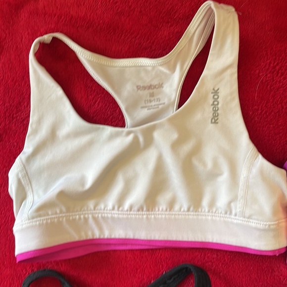 Lot of 7 sports bras. Most are xs, at least one small and one kids 10/12 - Picture 2 of 4